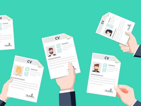 Image showing multiple hands holding up CVs